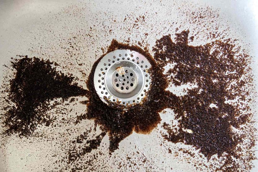 can coffee grounds go down the kitchen sink