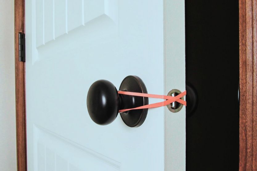 rubber bands over door handles
