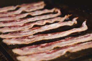 Read more about the article Undercooked Bacon – What Happens If You Eat It?